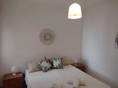 a bathroom with a sink and a toilet and a shower at Butterfly Apartments in Palermo