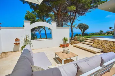 a living room with a couch and a table at Villa Marinjo in Alcamo