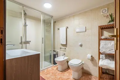 a bathroom with a toilet and a sink and a shower at A casa di GIO&GRACE in Palermo