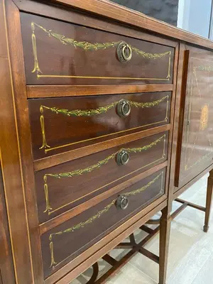 a wooden dresser with three drawers on it at La Casetta di Fortunata in Palermo