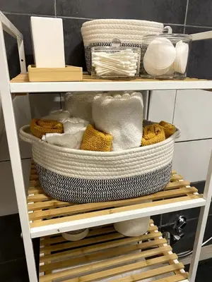 a shelf with towels and baskets on it at La Casetta di Fortunata in Palermo