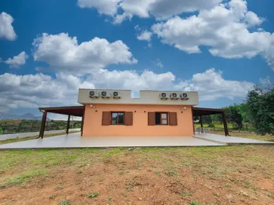 a small house in a field with a sky at Apartment MareLuna by Interhome in Balestrate