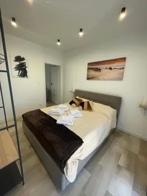 a bedroom with a bed with towels on it at Da Andrea in Carini