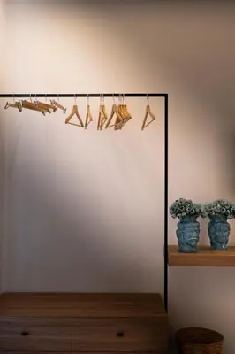 a shelf with shoes hanging from a clothes line at Al Capo Suite Home in Palermo