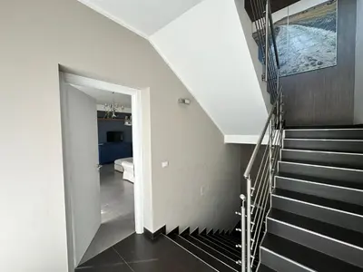 a staircase in a house with black and white at Matteotti 17 Easy in Cinisi