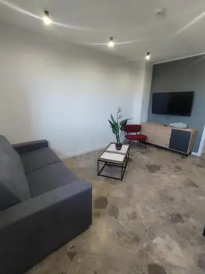 a living room with a couch and a flat screen tv at Da Pietro in Carini