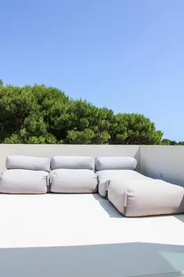 a white couch sitting on top of a wall at Villa Ippolita - Studio with Esclusive Terrace in San Vito lo Capo