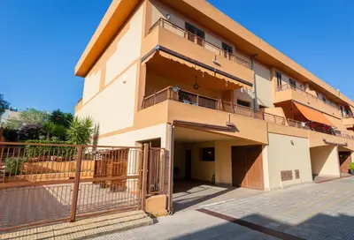 an apartment building with a balcony and a fence at Casa Leandra in Casteldaccia