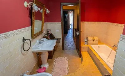 a bathroom with a sink and a bath tub at Casa Leandra in Casteldaccia