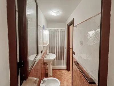 a bathroom with a sink and a toilet and a shower at Kemonia home in Palermo