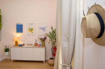 a room with a desk and a curtain at Enjoy Palermo in Palermo