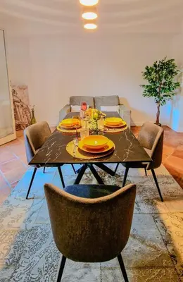 a dining room with a table and chairs at Domus Dea in Mondello