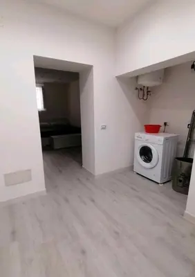 a laundry room with a washer and dryer at La Casetta di Nonno Settimo in Palermo