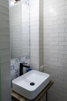 a white sink in a bathroom with a mirror at Casetta Bianca Luxury in Santa Flavia
