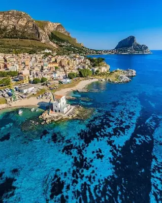 an aerial view of a small island in the ocean at Casetta Bianca Luxury in Santa Flavia
