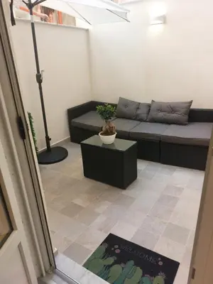 a potted plant sitting on a floor next to a door at Quiet House Palermo in Palermo