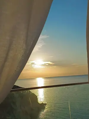 a view of the water near a rocky cliff at Amunì Guest House in Carini