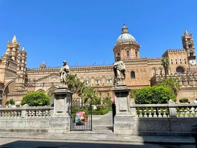 a large building with a statue in front of it at Al Duomo apartment in Palermo in Palermo