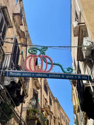 a sign hanging from the side of a building at Al Duomo apartment in Palermo in Palermo