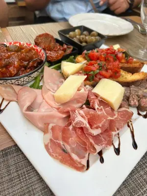 a plate of meat and cheese and other foods on a table at Vento di Sicilia in Carini