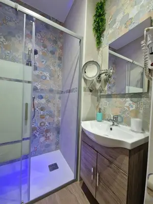 a bathroom with a sink and a shower at Da poppa a prua in Palermo