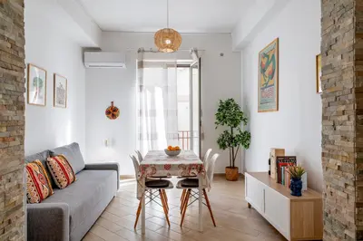a living room with a couch and a table at Casa del Saraceno in Palermo