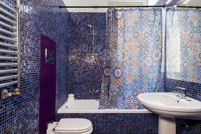 a bathroom with a sink and a toilet and a shower at Casa del Saraceno in Palermo