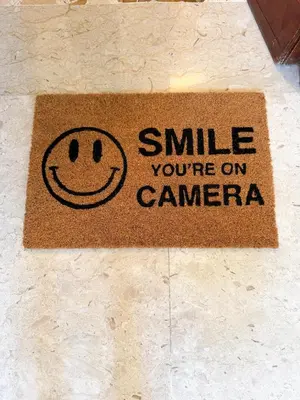 a smile youre on camera sign on a floor at Casa Nonna Pina in Palermo