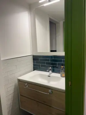 a bathroom with a sink and a mirror at santa Rosalia home in Palermo