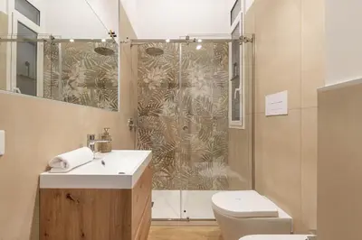 a bathroom with a shower and a sink and a toilet at Casa Florio Love Palermo in Palermo