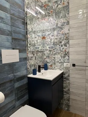 a bathroom with a sink and a toilet at Magione House Rooms in Palermo