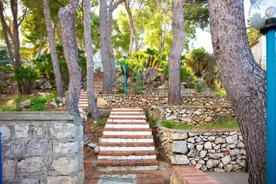 a set of stairs in a park with trees at Solemar Sicilia - Villa Giovitto in Bagheria