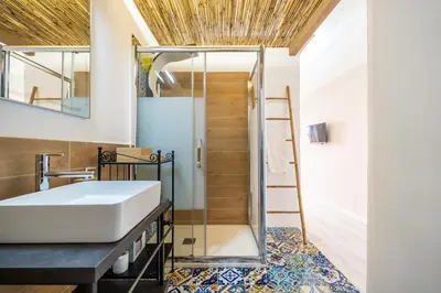 a bedroom with a bed with towels on it at Historic soul apartment in Palermo
