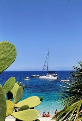 a view of a beach with boats in the water at La casa di Tiziana in Castellammare del Golfo