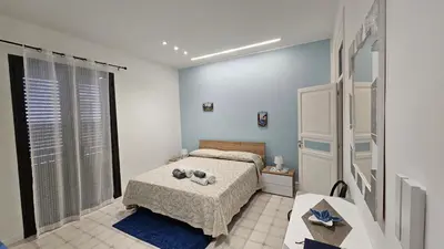 a bedroom with a bed and a table in it at 