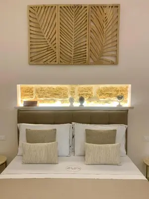 a living room with a large flat screen tv at Zisa Suite 2 in Palermo