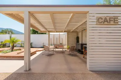 a covered patio with a table and chairs at 14th Oasis Villa With Private Pool Near Palermo in Carini