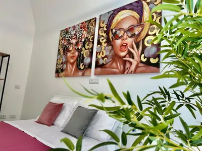 a living room with two paintings on the wall at Leonetti Due in Carini
