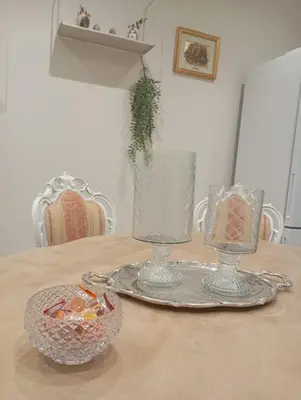 a kitchen with a counter with flowers on it at Grand Holiday Home Namarì in Palermo