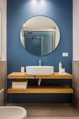 a bathroom with a sink and a mirror at Capo D'Amuri in Palermo
