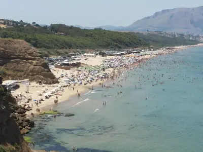 a group of people in the water at the beach at Casa Vacanze Fabrizio in Balestrate