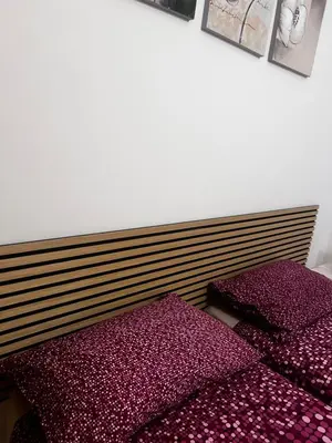 two beds in a room with purple pillows at Casa Vacanze Fabrizio in Balestrate