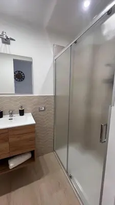 a bathroom with a shower and a sink at Amuní Holiday House in Cinisi