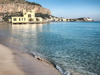a house on the beach next to the water at Come a Casa by Holiday World in Palermo