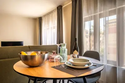 a dining room table with a bowl of fruit on it at Turrisi Apartment in Palermo