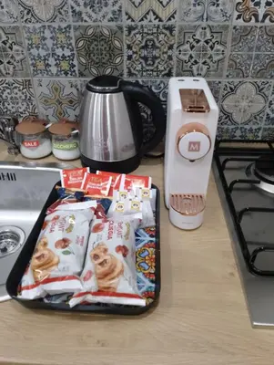 a kitchen counter with a tray of food on a stove at Holiday House Annunziata 1 in Termini Imerese
