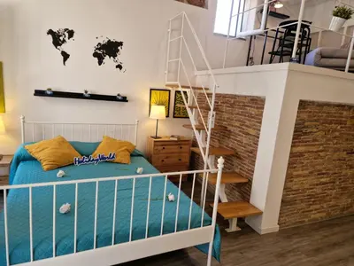 a bedroom with a bunk bed with a staircase at Il Fico d'India by Holiday World in Palermo