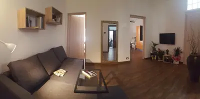 a living room with a couch and a table at Oasi del Libro in Castellammare del Golfo