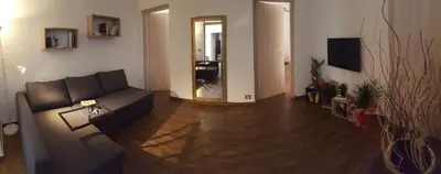a living room with a couch and a mirror at Oasi del Libro in Castellammare del Golfo