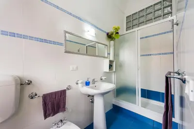 a bathroom with a sink and a shower at Oasi del Libro in Castellammare del Golfo